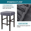 A dark gray fabric bar stool slipcover featuring a textured pattern and an elastic bottom for a perfect fit.