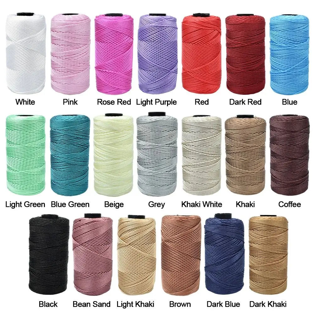 A collection of various colored and textured threads for knitting and crochet including white pink red blue and various shade