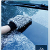 A hand wearing a black glove is using an ultra-soft microfiber wheel cleaning brush on a car surface for deep dust removal.