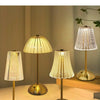 Three modern crystal touch table lamps with gold bases and translucent shades displayed on a light surface.