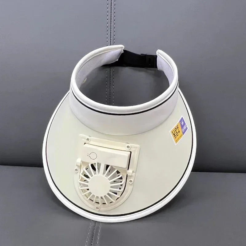 A white cooling fan hat with a black strap and a visible fan grille is displayed against a gray background.