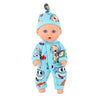 A baby doll wearing a light blue jumpsuit outfit with a matching hat and a small decorative item on top.