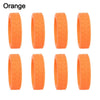 A set of orange silicone luggage wheel protectors designed to prevent scratching and reduce noise during travel.