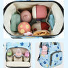 A blue diaper bag backpack showing milk bottle insulation pockets and side storage pockets.