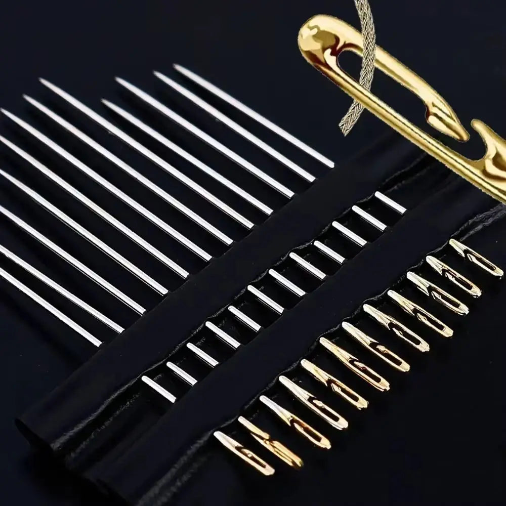 A set of gold-tipped self-threading sewing needles with side holes displayed on a black background.