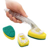 A hand is dispensing liquid soap from a dish wand brush into a yellow sponge head.