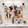 A set of two cartoon cat kitchen towels featuring orange and black cats on a white background.