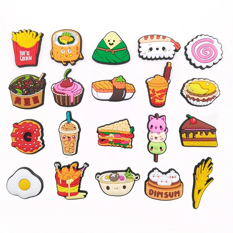 A collection of colorful PVC pins featuring various food items like sushi, ice cream, and fruit for decoration.