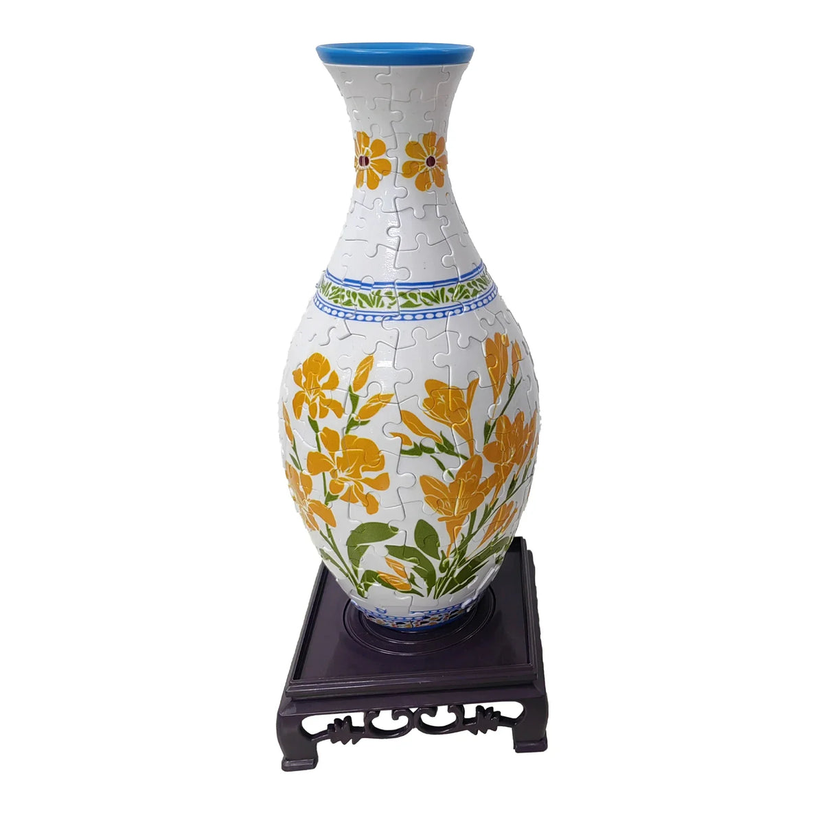 A white ceramic vase with yellow floral designs and blue accents, displayed on a dark stand.