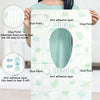 A person holds a disposable toilet seat cover, showing various glue points and anti-adhesive layers.