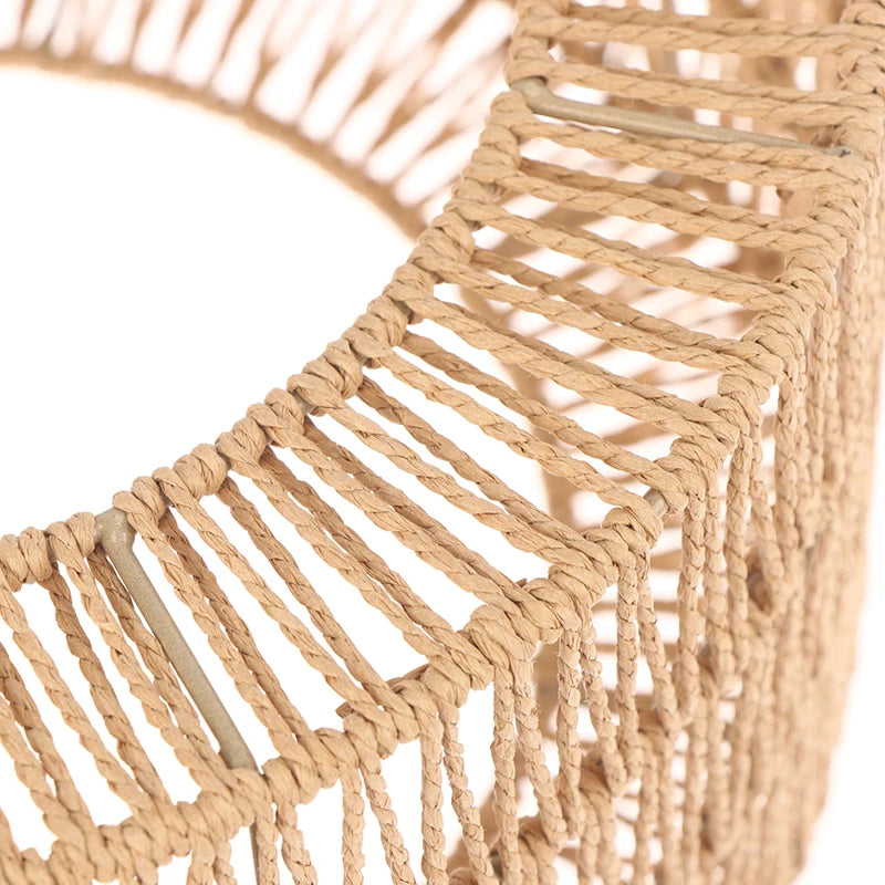 Close-up of a woven paper rope lampshade featuring natural beige fibers and a light wood accent.
