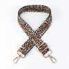 A leopard print wide adjustable crossbody bag strap in brown and black spots.