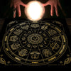 Hands illuminate a mystical zodiac tarot tablecloth with astrological symbols and zodiac signs.