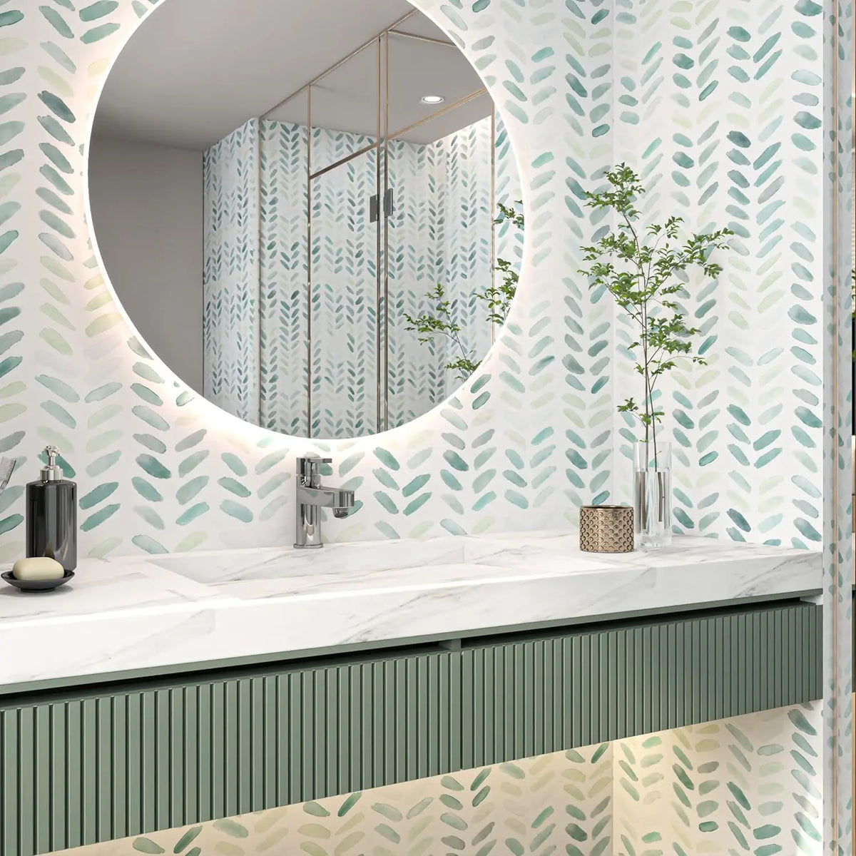 A bathroom vanity featuring white marble countertop and a large circular mirror surrounded by a green and white leaf pattern.