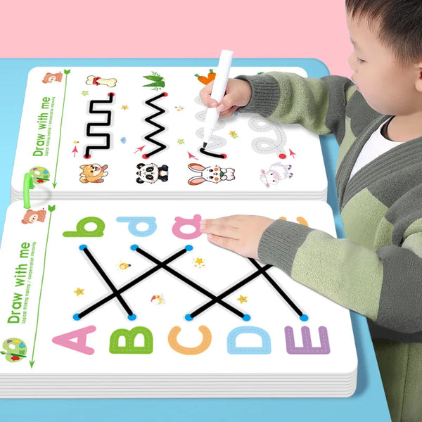 A child is drawing on a reusable magic tracing workbook with a pencil, showing various lines and letters.