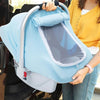 A woman holds a light blue breathable 2-in-1 car seat cover and mosquito net for babies.