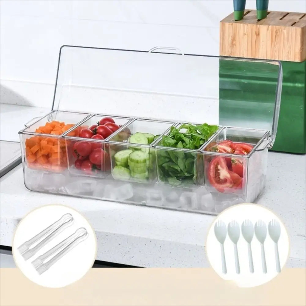 A clear plastic 5-compartment chilled condiment server with an ice base holding various fresh vegetables.