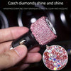 Close-up of a pink rhinestone dual USB car charger with dazzling clear and dazzling craftsmanship.