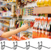 A hand is placing heavy duty grid hooks onto a display rack of colorful beaded items.