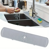 A silicone faucet drain mat is shown placed over a kitchen sink, protecting the countertop.