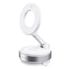 A white magnetic car phone mount with a rotating mechanism and vacuum suction base.