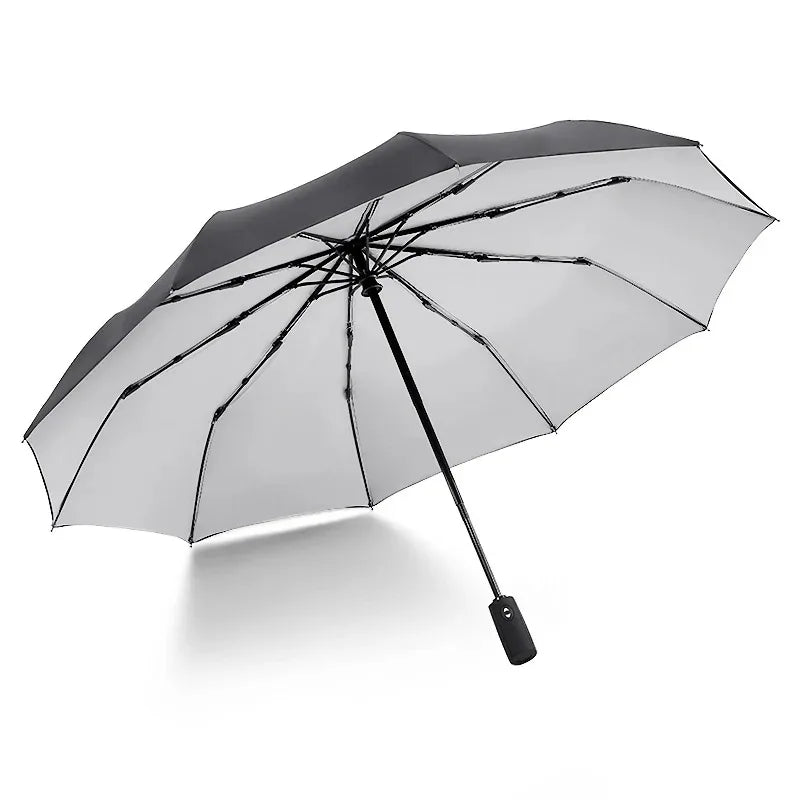 A black double-layer windproof umbrella open and angled against a white background.