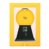 A vintage yellow frame displaying a black rotating candy display frame with a green dust cover.