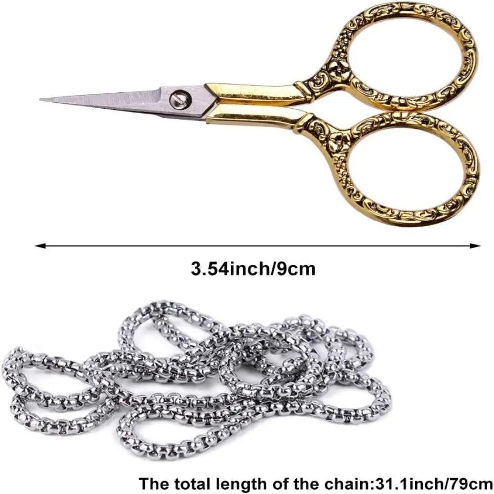 Vintage stainless steel sewing scissors and a chain measuring 3.54 inches long