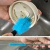 A hand holds a blue bottle cleaning brush and a silicone brush, demonstrating the set.