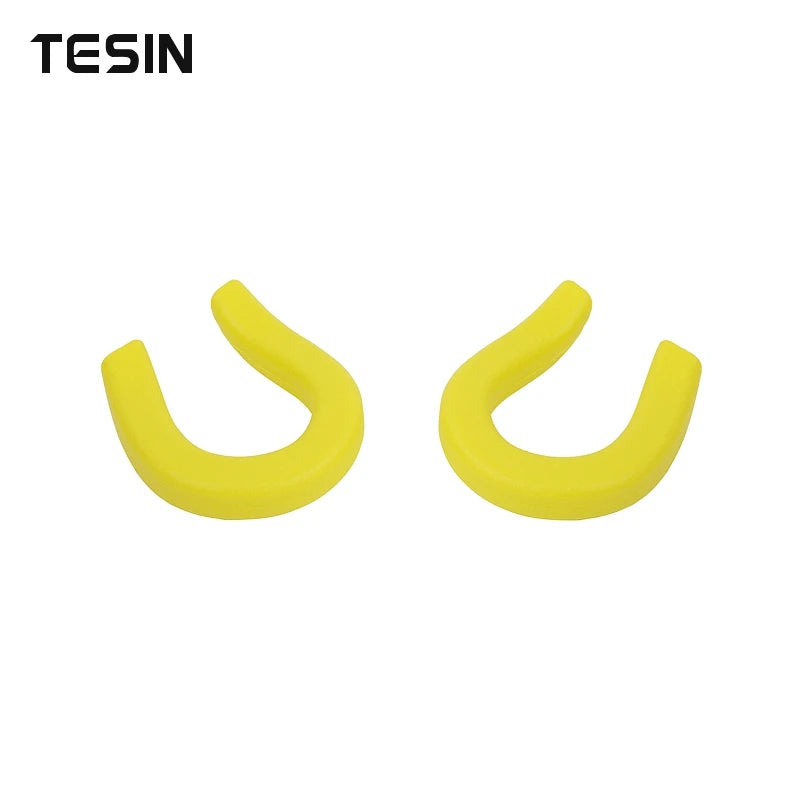 A pair of yellow front bumper tow hook covers for Chevrolet Silverado and GMC Sierra trucks.
