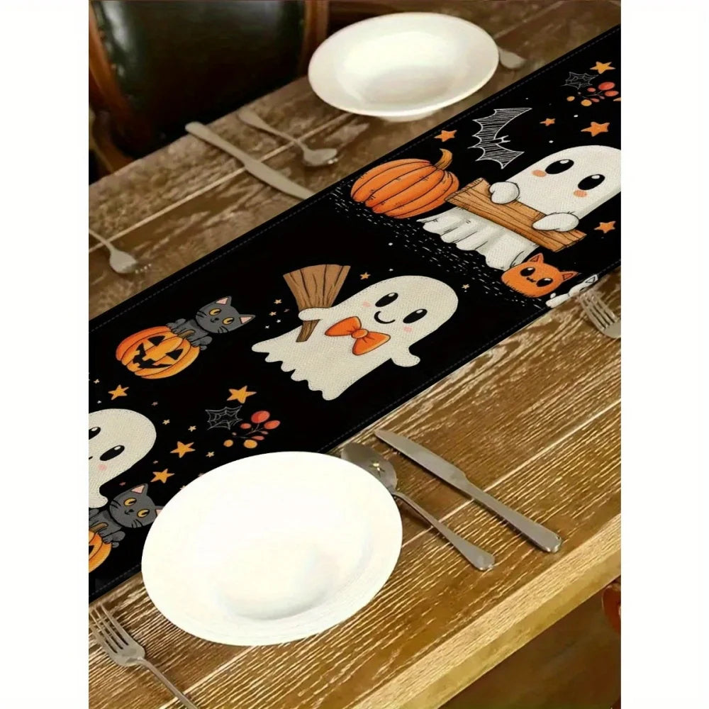 Black Halloween table runner featuring pumpkins, bats, and jack-o'-lanterns designs.
