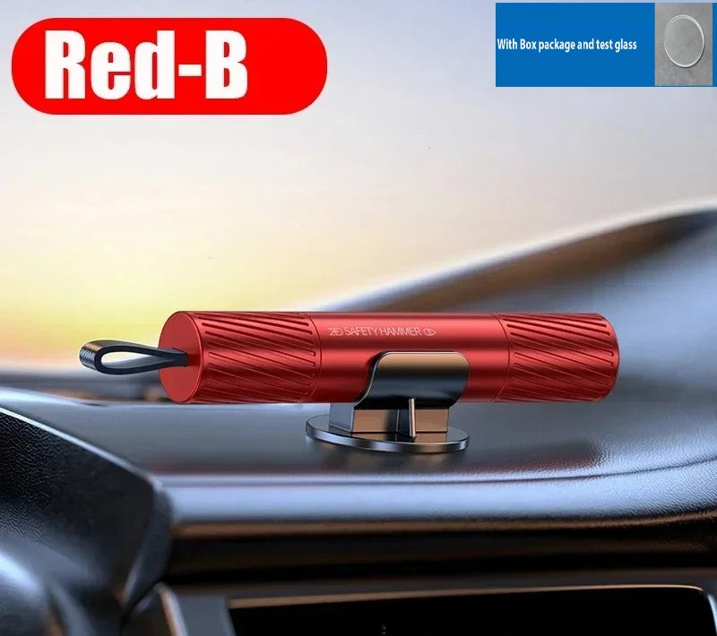 A red silicone car emergency hammer with a handle and a metal base is shown on a car interior surface.