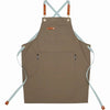A tan cotton canvas apron with adjustable straps and multiple pockets for kitchen or salon use.