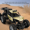 A gold and black six-wheel drive off-road RC car with a wear-resistant alloy body in a desert setting.