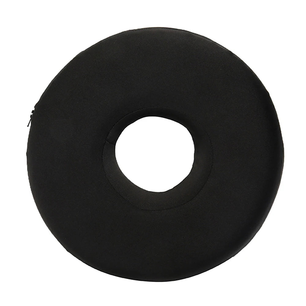 Black memory foam ear piercing pillow with a circular cutout for side sleepers