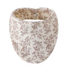 A beige organic cotton muslin baby bib with a floral print and an absorbent band.