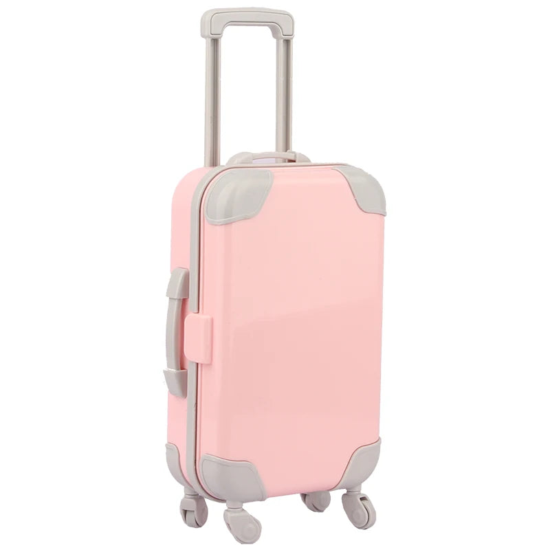 A pink and gray doll travel suitcase with a handle and wheels.