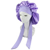 Purple satin sleep cap for hair protection displayed on a mannequin