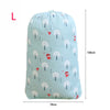 Light blue drawstring laundry bag featuring a pattern of white trees and red figures.