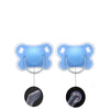 A pair of light blue silicone baby pacifiers with a flower design and protective cover shown alongside the inner structure.