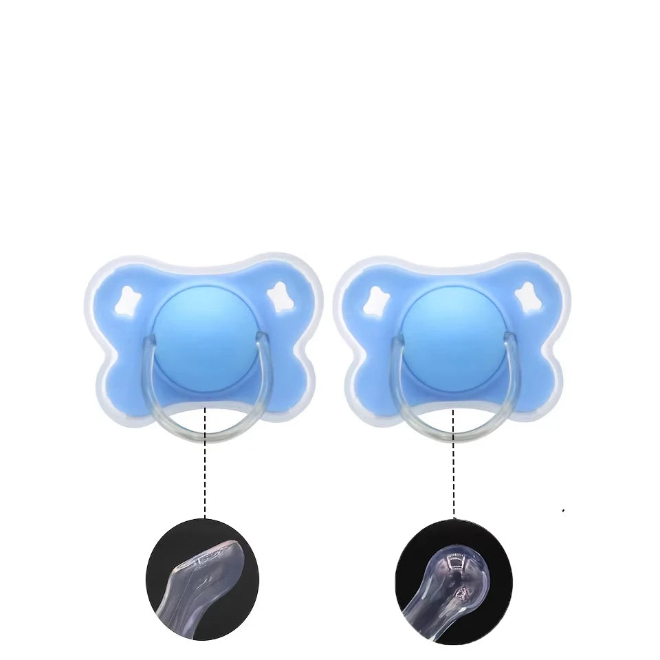 A pair of light blue silicone baby pacifiers with a flower design and protective cover shown alongside the inner structure.