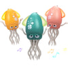 Three colorful interactive dancing squid toys with tentacles and musical notes