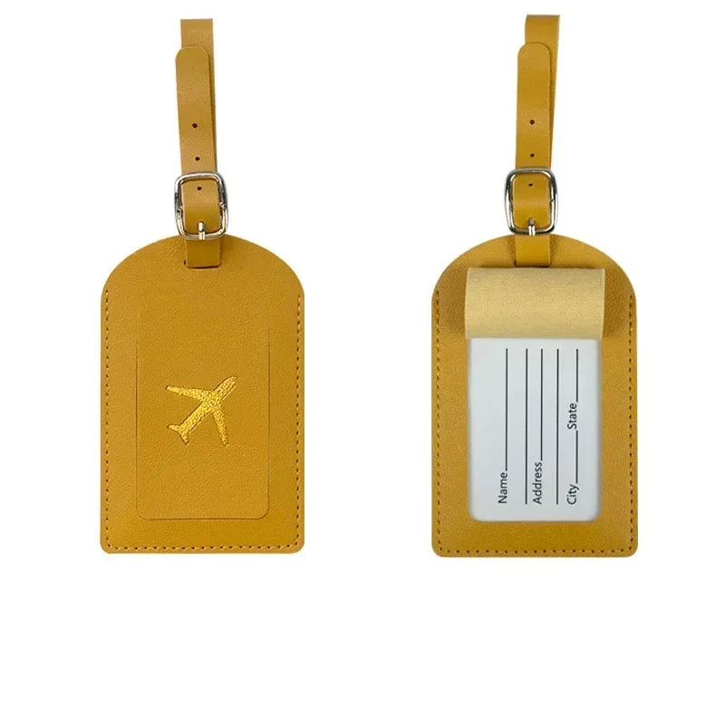 A yellow PU leather luggage tag with a gold airplane design and a clear plastic holder.