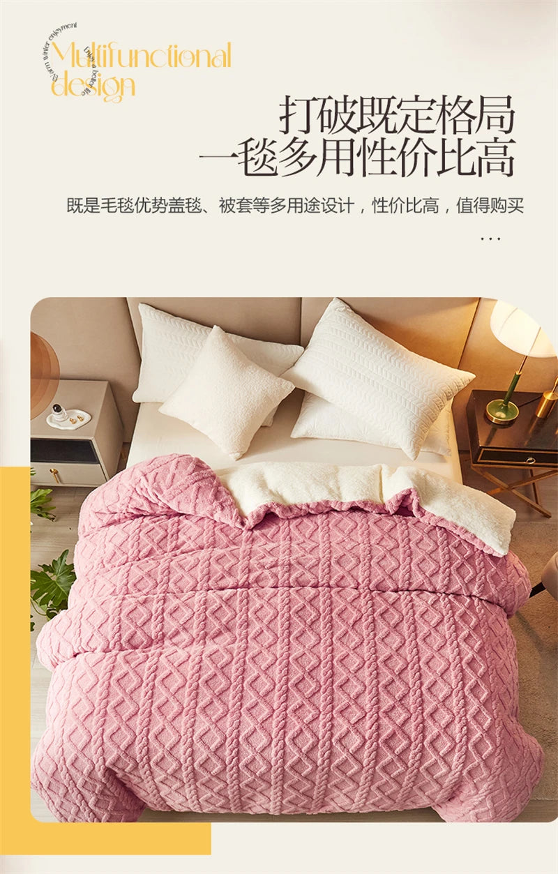 A pink quilted duvet cover and blanket displayed on a bed with white pillows.