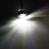 A compact LED side marker light shining a bright beam of light.