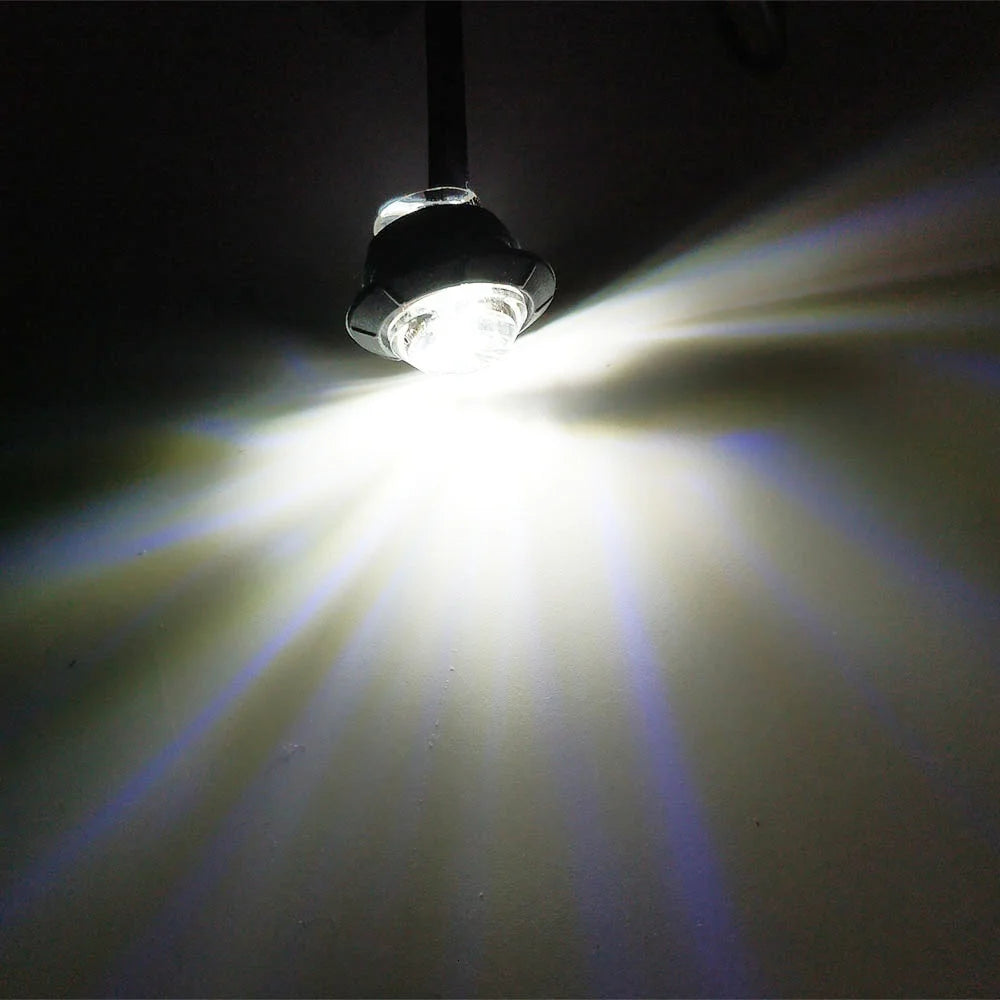A compact LED side marker light shining a bright beam of light.