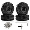 Set of four black metal beadlock RC crawler wheels with tires and mounting hardware