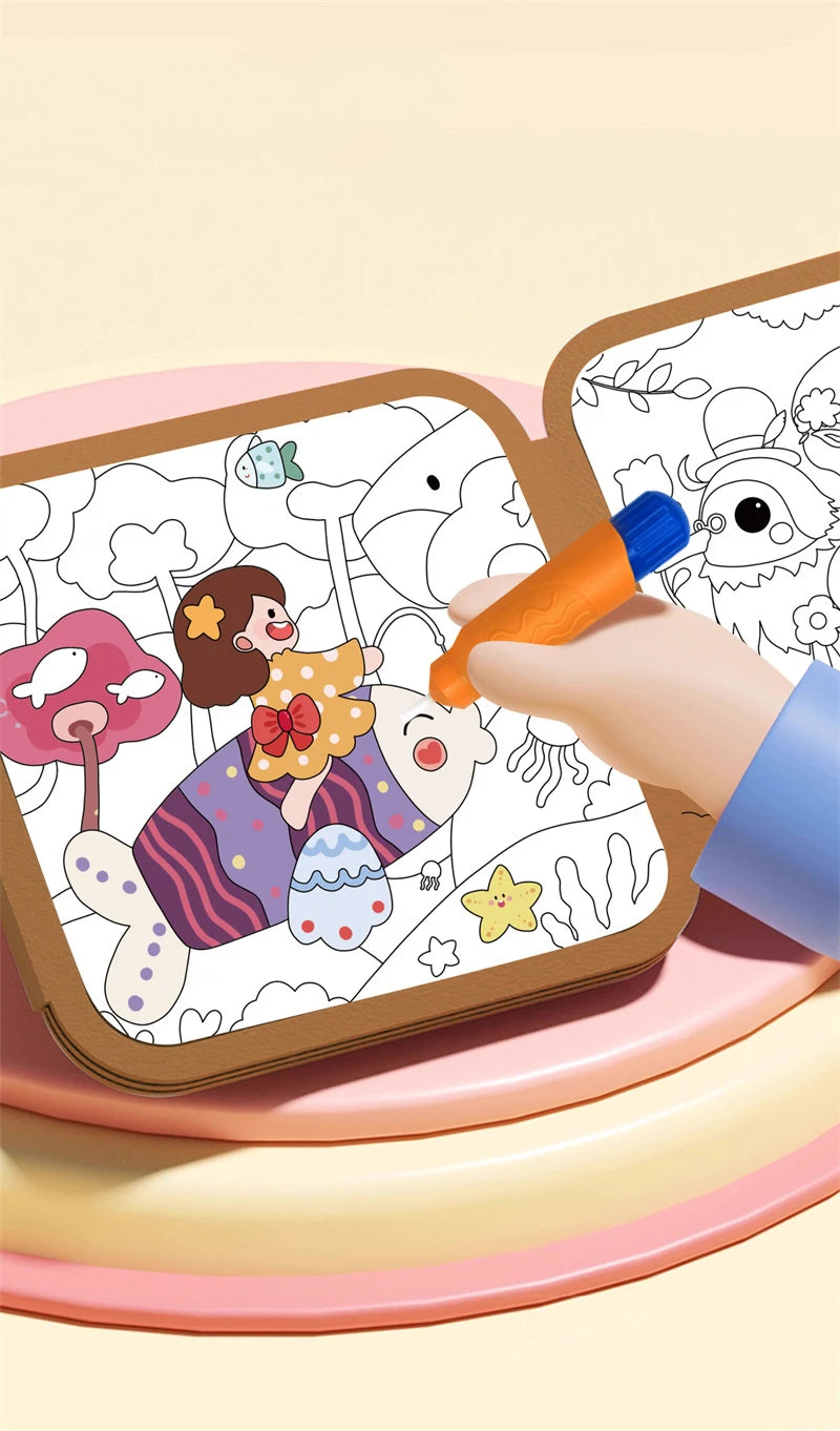 A hand is drawing on a reusable water drawing book for kids, showing colorful illustrations.