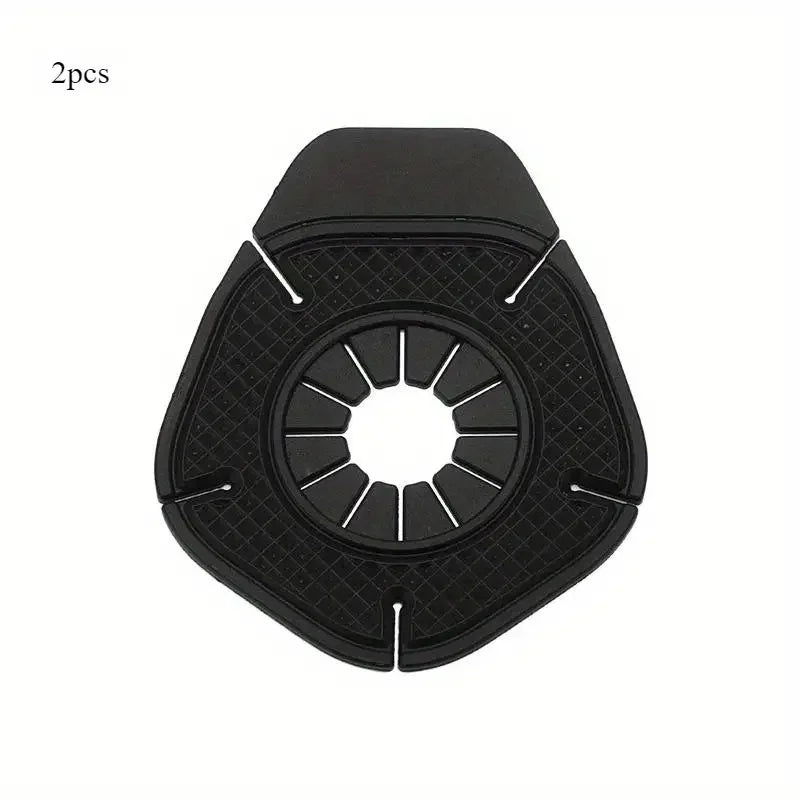 Two black wiper arm hole covers with a central opening and surrounding protective structure.