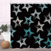 Black fabric shower curtain featuring a geometric pattern of white and teal stars.
